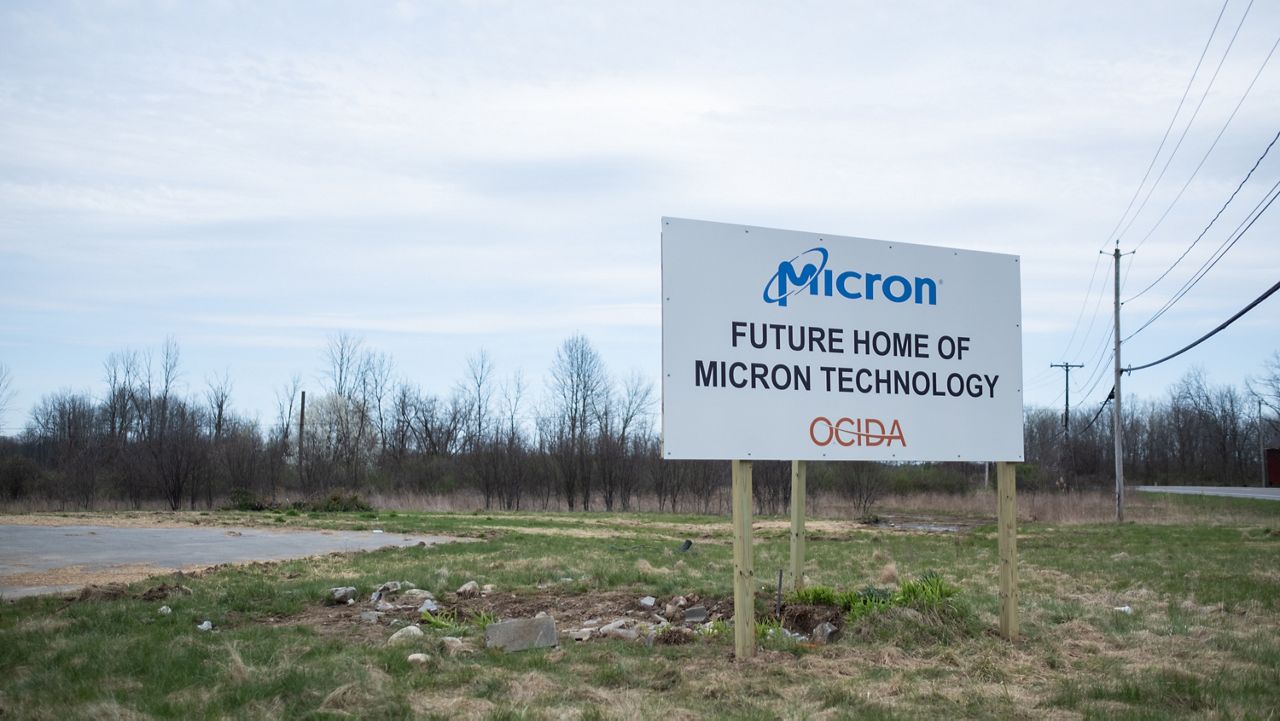 micron sign for future development in empty lot outside syracuse, n.y. sign reads 'future home of micron technology'