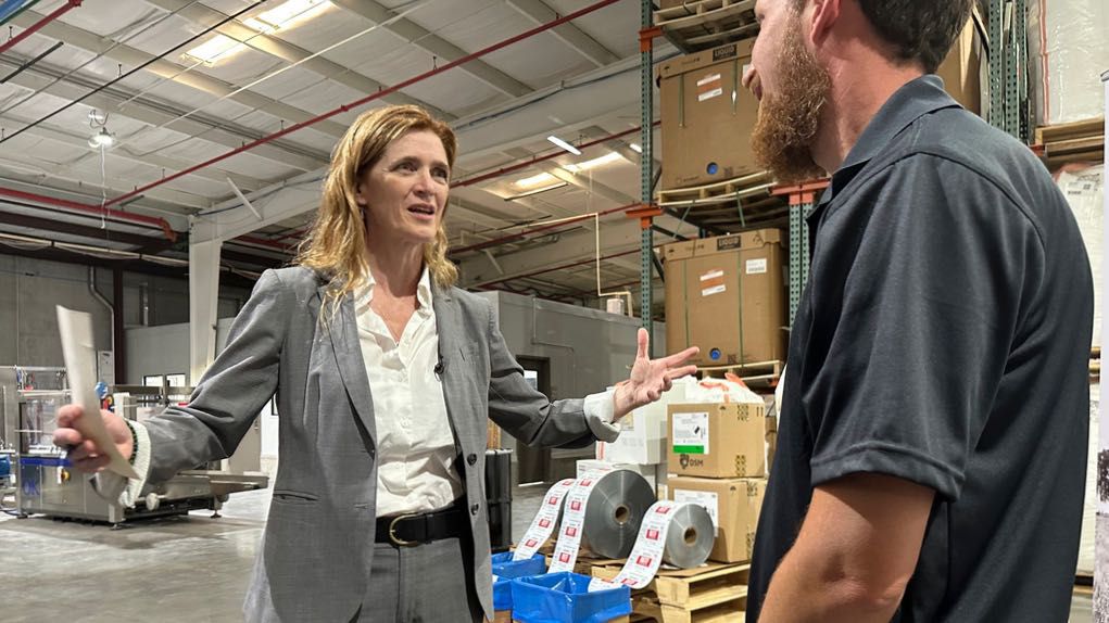 USAID Administrator Samantha Power talks with a worker Friday, May 3, 2024, during a tour of the factory where the nonprofit Mana makes emergency nutritional aid in Fitzgerald, Georgia. Power announced USAID is investing $200 million in emergency nutritional treatment for starving children as conflicts in Gaza, Sudan and elsewhere drive up the need. (AP Photo/Russ Bynum)