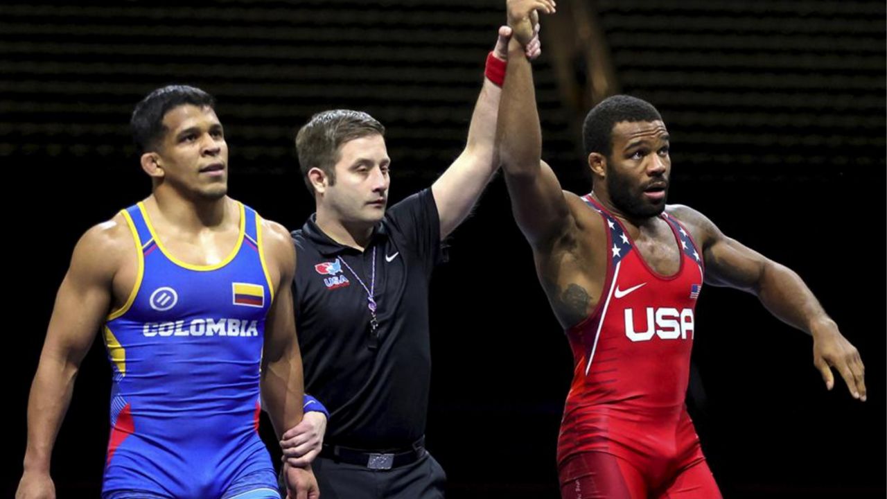 United States' Jordan Burroughs is declared the winner of Colombia's Nestor Taffur in a wrestling bout Saturday, Feb. 12, 2022, at Globe Life Field in Arlington, Texas, as the U.S. faced a team of international stars. (Steve Nurenberg/The Dallas Morning News via AP)