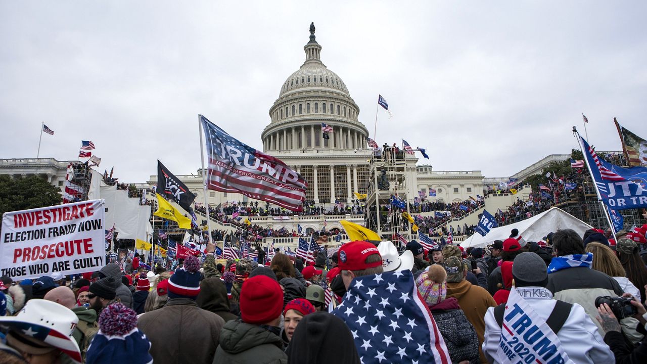 Insurrectionists loyal to President Donald Trump rally at the U.S. Capitol on Jan. 6, 2021, in Washington. Nathan Donald Pelham, 40, a Texas man who agreed to surrender on charges from taking part in the U.S. Capitol riot, but later that day fired a gun toward sheriff's deputies who went to his house in response to a welfare call, was arrested Tuesday, April 18, federal prosecutors said Thursday, April 20, 2023. Pelham, 40, allegedly fired the shots from his rural home on April 12, the same day he was told he was charged with four misdemeanors for allegedly participating in the Jan. 6 attack. In addition, he was charged with being a felon in possession of a firearm, prosecutors said.(AP Photo/Jose Luis Magana, File)