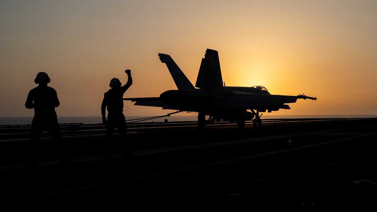 A fighter jet lands on the USS Dwight D. Eisenhower, also known as "IKE," in the Red Sea on Tuesday, June 11, 2024. The U.S.-led campaign against Iran-backed Houthi rebels has turned into the most intense running sea battle the Navy has faced since World War II. (AP Photo/Bernat Armangue)