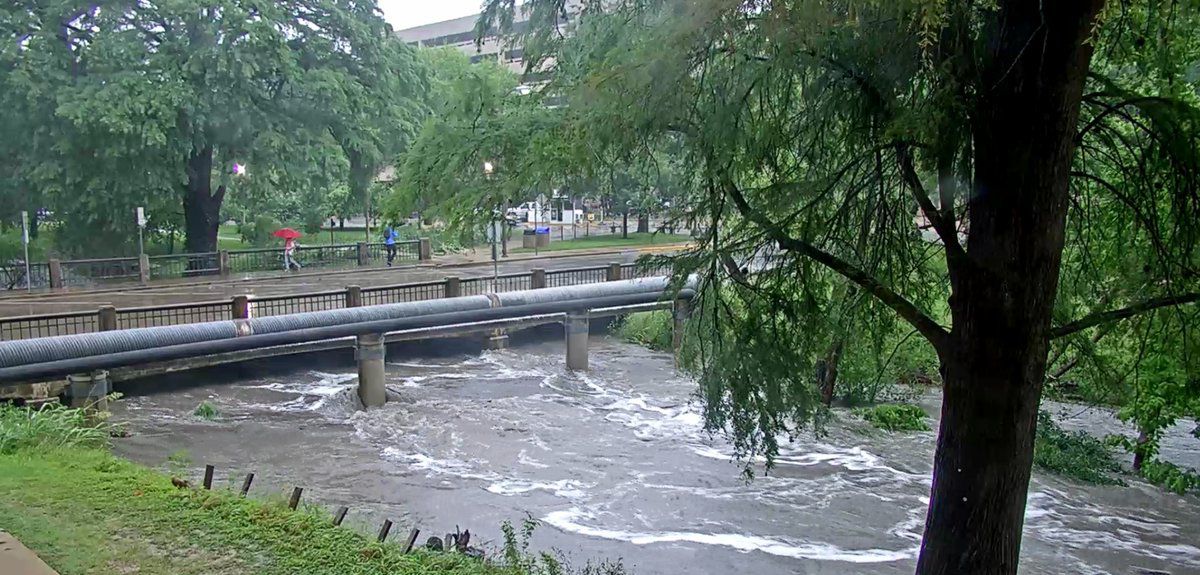 Waller Creek is rapidly rising at San Jacinto Boulevard on University of Texas at Austin campus. 