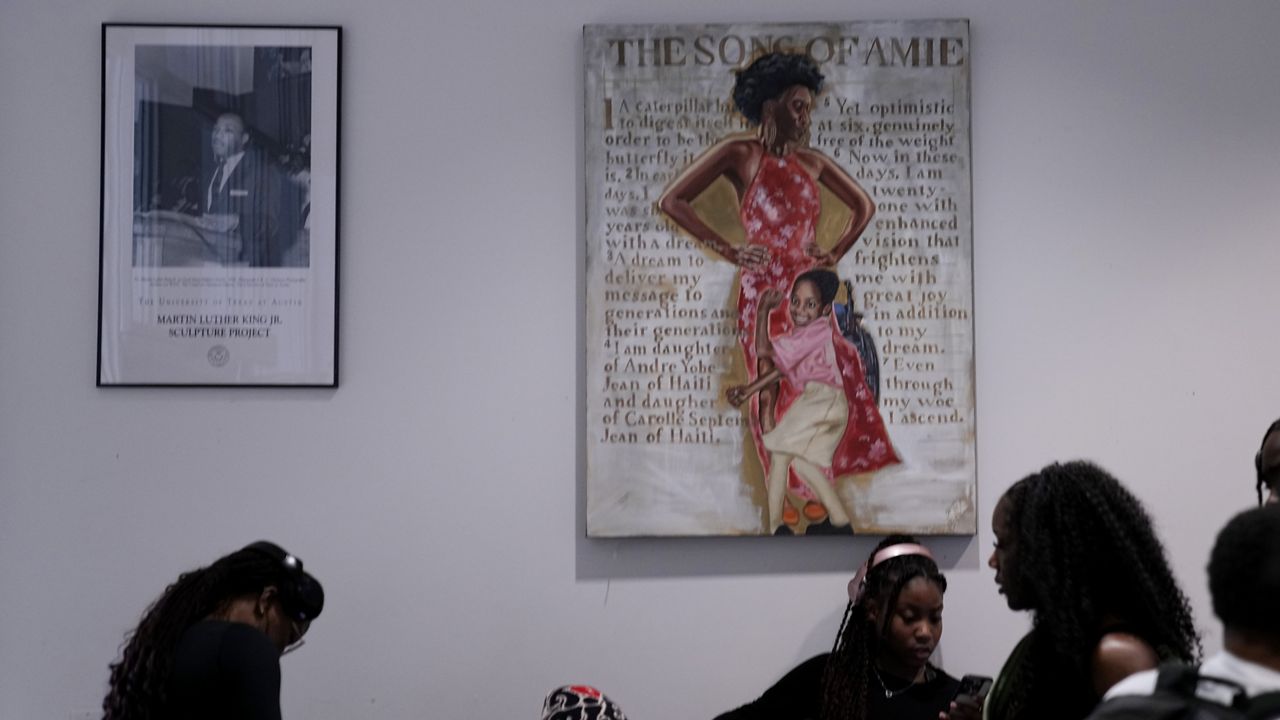 University of Texas at Austin students continue to make use of a space that housed the school's "Multicultural Center" after the name was removed from the wall, Jan. 29, 2024, in Austin, Texas. (AP Photo/Eric Gay)