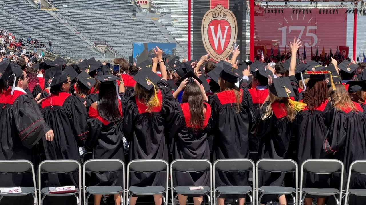 Students dance during a performance by the Mad Hatters at the 2024 commencement ceremony. (Spectrum News 1/Natalie Sopyla)