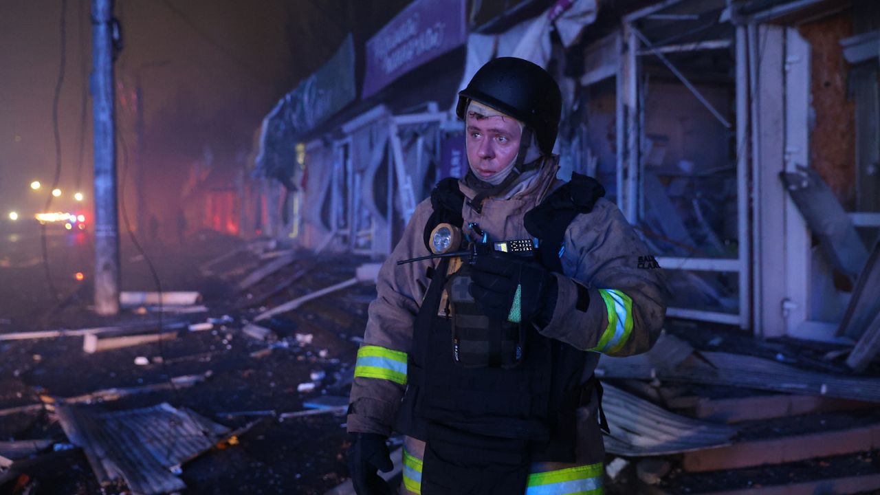 A rescuer works at a market destroyed by a Russian airstrike on Zaporizhzhia, Ukraine, Friday, Nov. 21, 2025. (AP Photo/Kateryna Klochko)