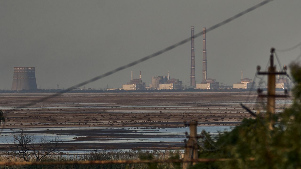 The Zaporizhzhia nuclear power plant, Europe's largest, is seen in the background of the shallow Kakhovka Reservoir after the dam collapse, in Energodar, Russian-occupied Ukraine, Tuesday, June 27, 2023. Officials at the Russian-controlled Zaporizhzhia Nuclear Power Plant said that the site was attacked Sunday April 7, 2024, by Ukrainian military drones, including a strike on the dome of the plant’s sixth power unit. (AP Photo/Libkos, File)