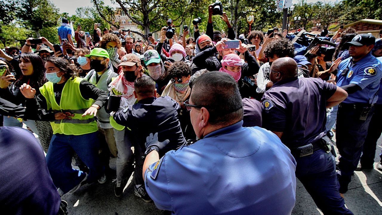 University of Southern California protesters push and shove University Public Safety officers as tempers get heated during a pro-Palestinian occupation on the University of Southern California campus Wednesday, April 24, 2024 in Los Angeles. (AP Photo/Richard Vogel)