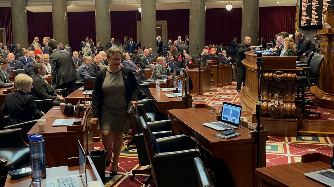 State Rep. Sarah Unsicker, D-Shrewsbury, returns to her desk on the floor of the Missouri House during the opening day of the 2024 General Assembly on Jan. 3, 2024 in Jefferson City, Mo. (Spectrum News/Gregg Palermo)