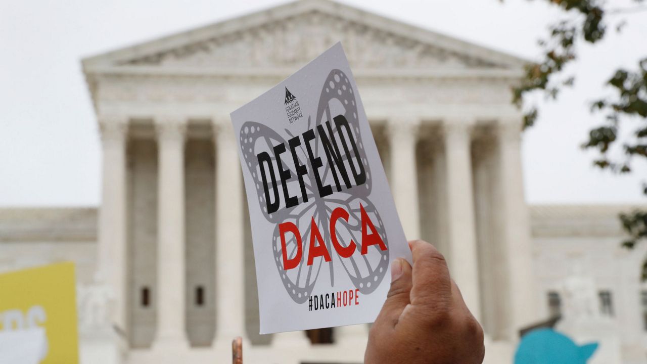People rally outside the Supreme Court in support of the Deferred Action for Childhood Arrivals program (DACA), in Washington, Nov. 12, 2019. The U.S. Department of Justice and a civil rights group say they plan to appeal a federal judge’s recent ruling declaring illegal a revised version of a federal policy preventing the deportation of hundreds of thousands of immigrants brought to the U.S. as children. (AP Photo/Jacquelyn Martin, File)
