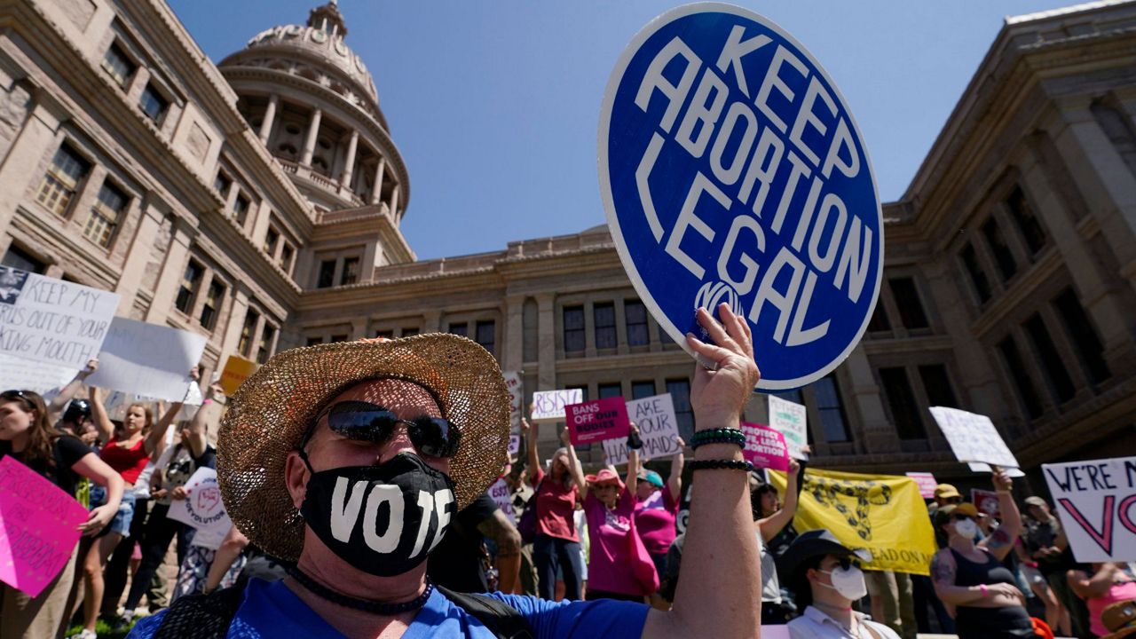 Abortion rights demonstrators attend a rally at the Texas state Capitol in Austin, Texas, May 14, 2022. A pregnant Texas woman whose fetus has a fatal diagnosis asked a court Tuesday, Dec. 5, 2023, to let her terminate the pregnancy, bringing what her attorneys say is the first lawsuit of its kind in the U.S. since Roe v. Wade was overturned last year.(AP Photo/Eric Gay, File)