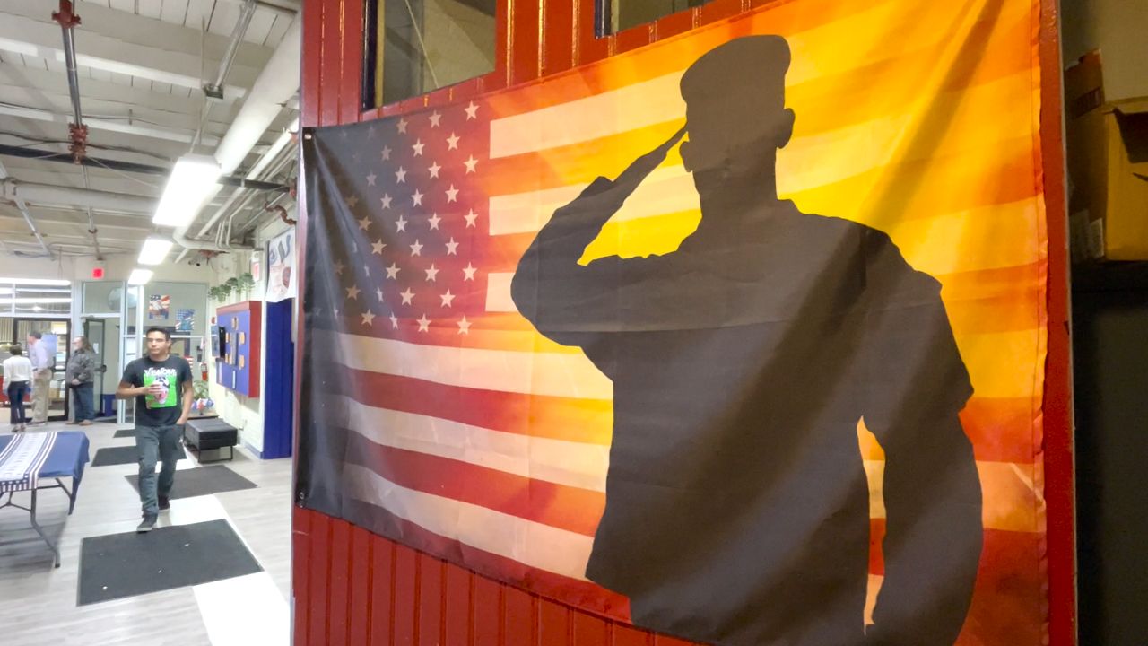 A flag hands inside the Veterans Inc. headquarters in Worcester. (Spectrum News 1/Devin Bates)