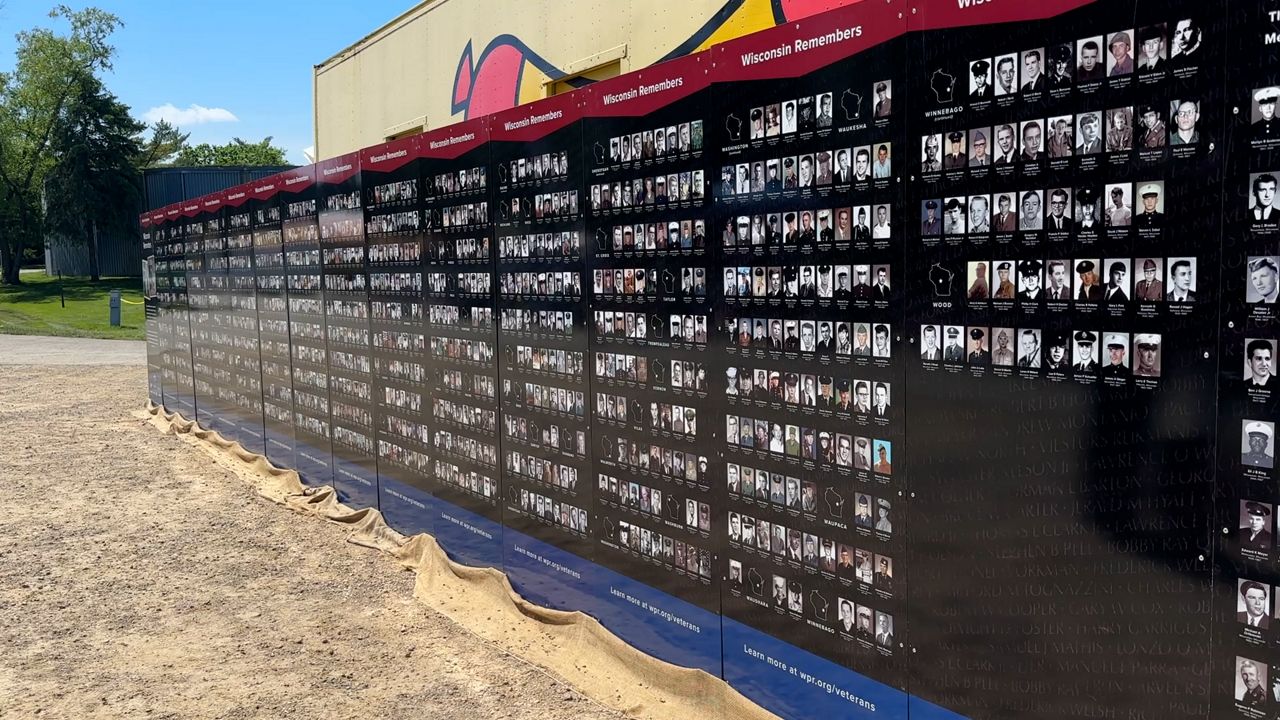 wall of “Wisconsin Remembers: A Face for Every Name”