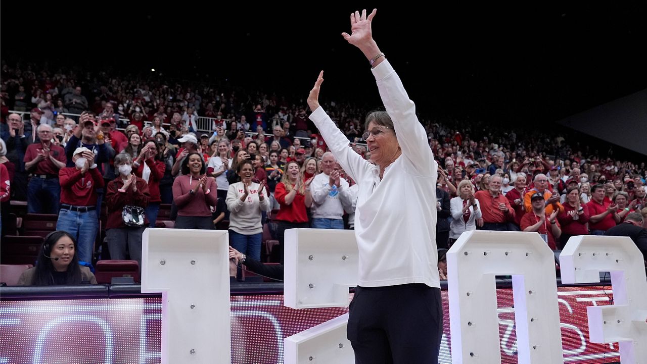 Stanford head coach Tara VanDerveer waves to the crowd after breaking the college basketball record for wins with her team's victory over Oregon State in an NCAA college basketball game, Sunday, Jan. 21, 2024, in Stanford, Calif. (AP Photo/Godofredo A. Vásquez)