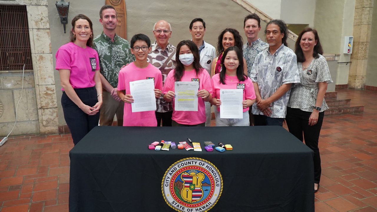 Youth and community advocates joined Mayor Rick Blangiardi (fourth from right) and Honolulu City Council member Matt Weyer (second from right) in a signing ceremony for Bill 47. (Office of Mayor Rick Blangiardi)