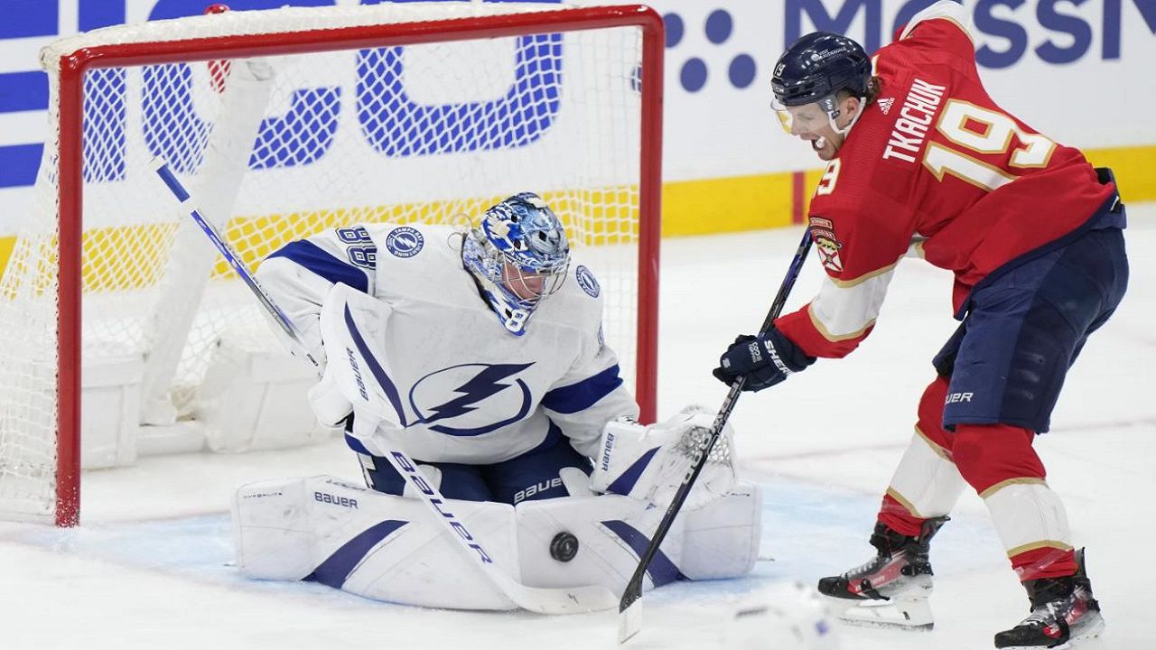 Panthers' LW Matthew Tkachuk (19) attempts a shot on Tampa BAy goalie Andrei Vasilevskiy during the first period of Game 1 of the Lightning-Panthers series. (AP Photo/Wilfredo Lee)