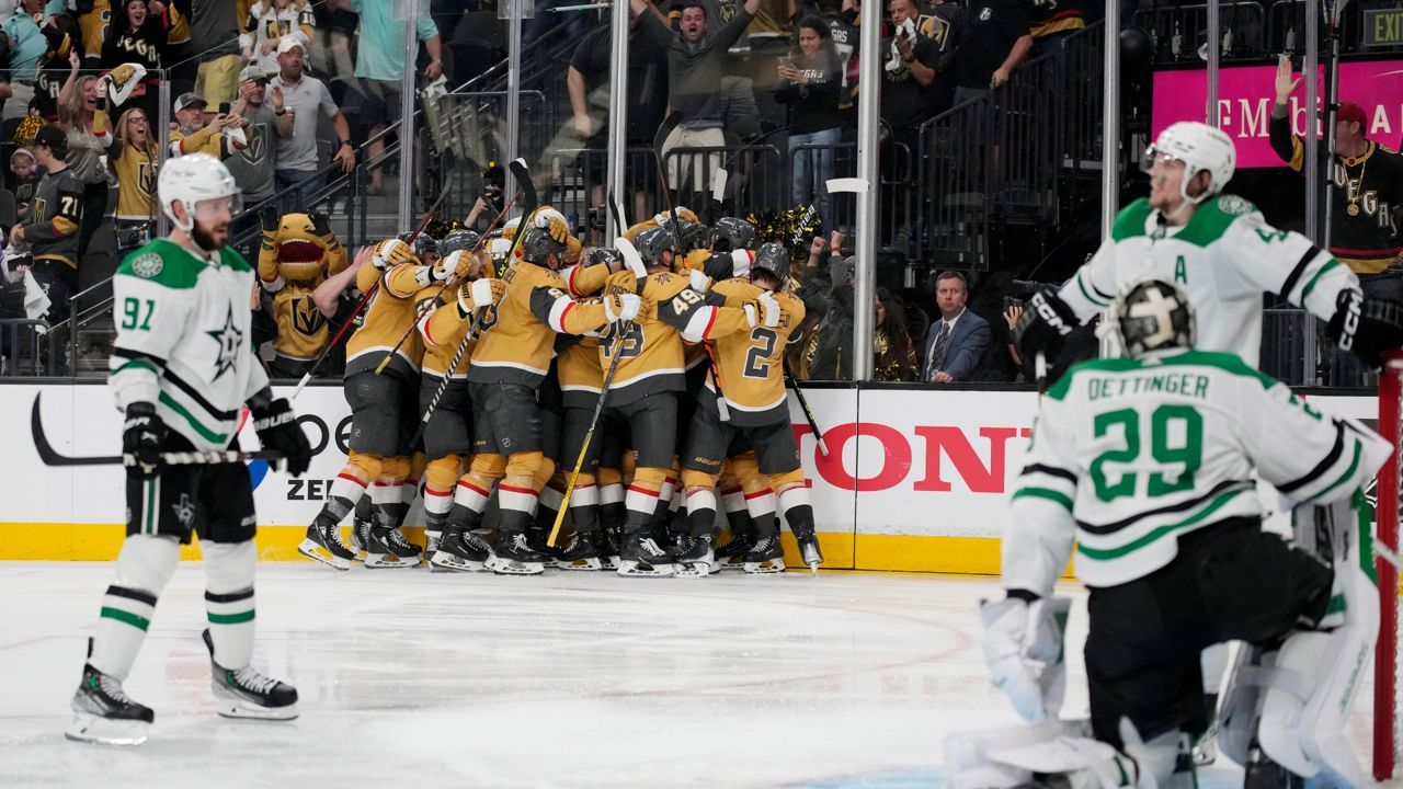 Vegas Golden Knights players celebrate after defeating the Dallas Stars during overtime of Game 1 of the NHL hockey Stanley Cup Western Conference finals Friday, May 19, 2023, in Las Vegas. (AP Photo/John Locher)
