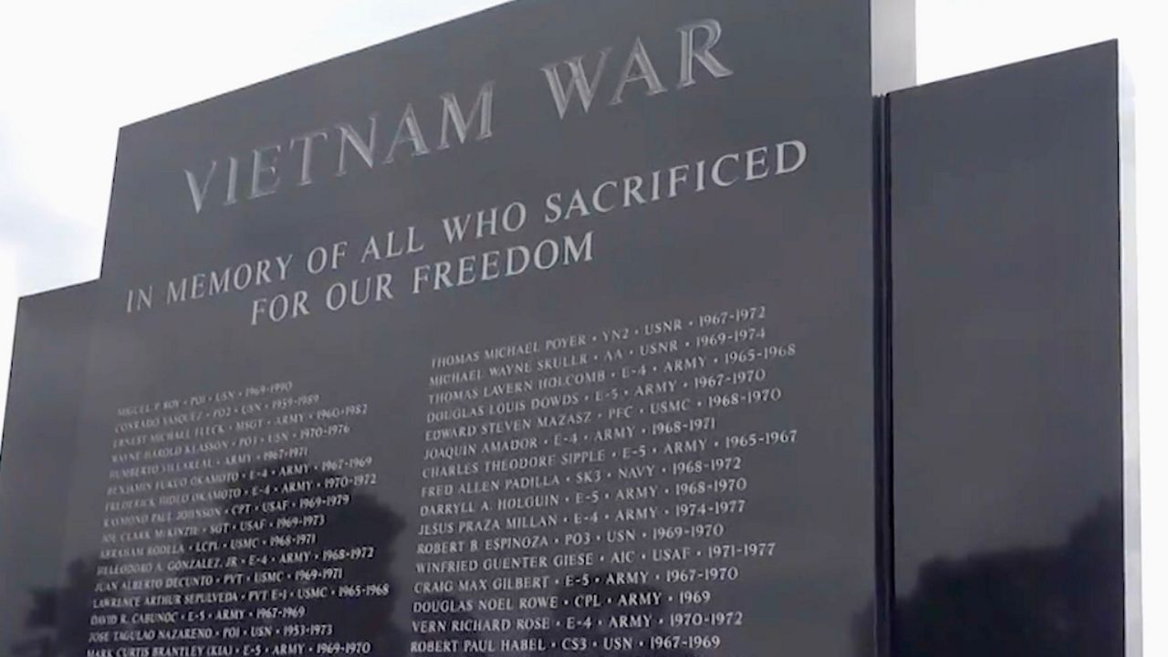 A man looks at a replica of the Vietnam Veterans Memorial wall in Rancho Palos Verdes.