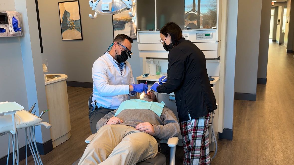Dr. Gregory Cook works on a patient at Belmont Dental. (Spectrum News 1/Melody Greene)