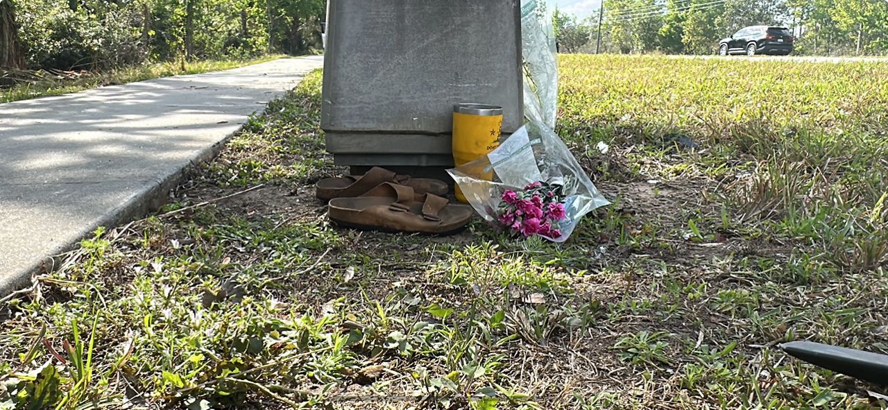 A small memorial was left at the scene of a car crash that killed four people on Central Florida Parkway. (Spectrum News 13/Brandon Spencer)