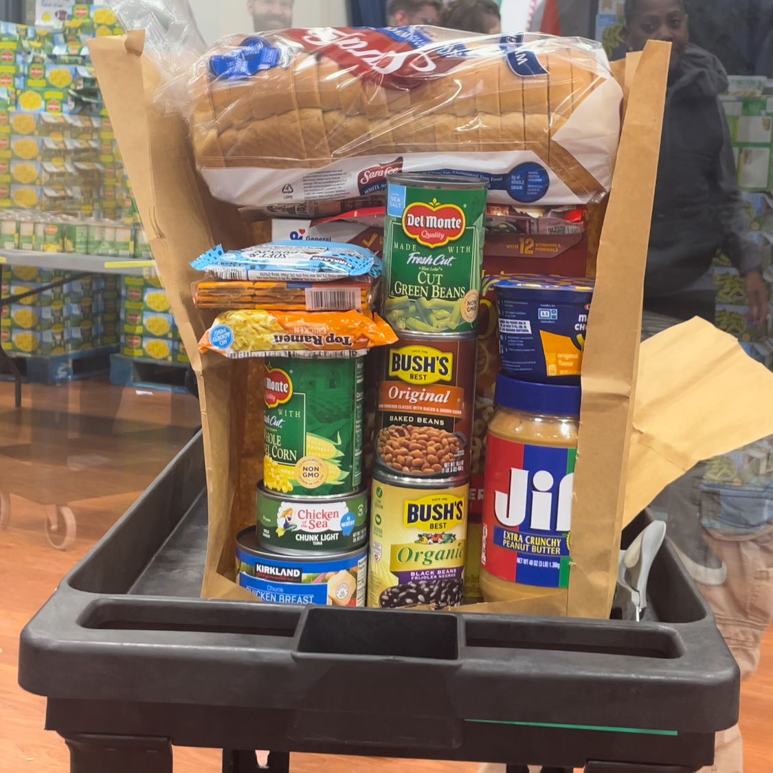 Each bag includes donated food items such as canned green beans, crackers, granola bars and bread. (Spectrum News 1/Eleanor Saunders)