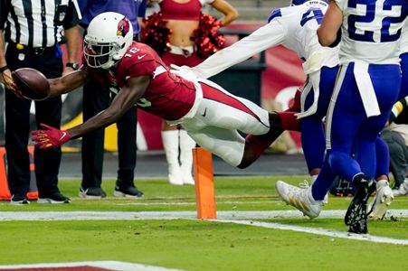 Arizona Cardinals running back James Conner (6) is hit by Minnesota Vikings  free safety Harrison Smith during the second half of an NFL football game,  Sunday, Sept. 19, 2021, in Glendale, Ariz. (