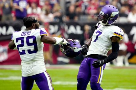 Arizona Cardinals running back James Conner (6) is hit by Minnesota Vikings  free safety Harrison Smith during the second half of an NFL football game,  Sunday, Sept. 19, 2021, in Glendale, Ariz. (