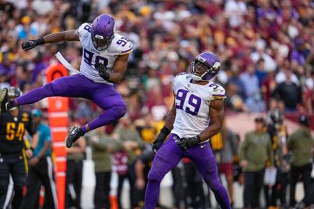 Minnesota Vikings linebacker D.J. Wonnum (98) reacting after sacking  Washington Commanders quarterback Taylor Heinicke during the