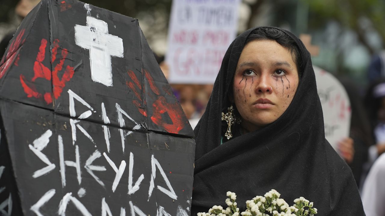 Ariana Campos takes part in a march marking the upcoming International Day for the Elimination of Violence Against Women, in Lima, Peru, Saturday, Nov. 23, 2024. (AP Photo/Guadalupe Pardo)