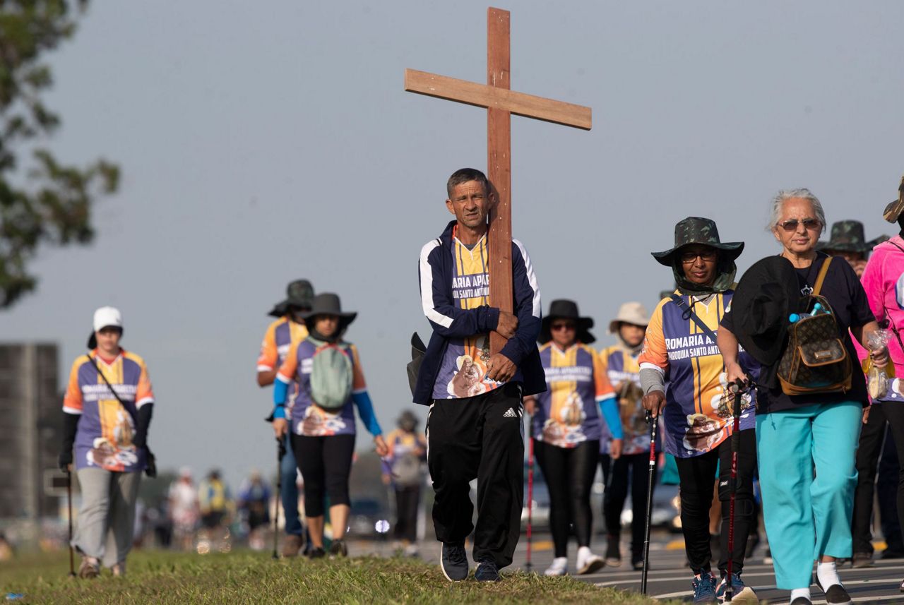 Brazil Catholics drawn to worship despite downsized services