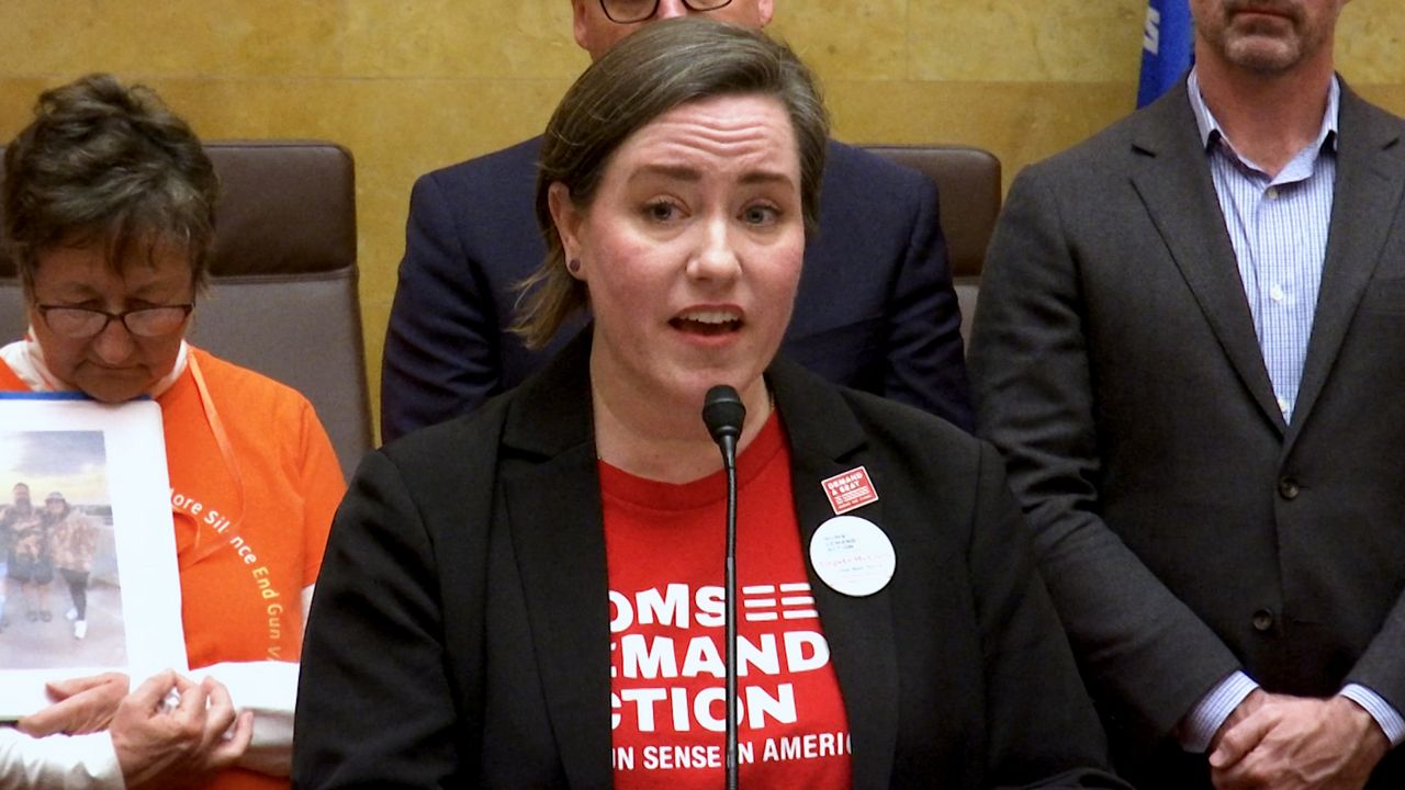 Angela McCully with Moms Demand Action speaks about gun safety measures. (Spectrum News 1/Anthony DaBruzzi)