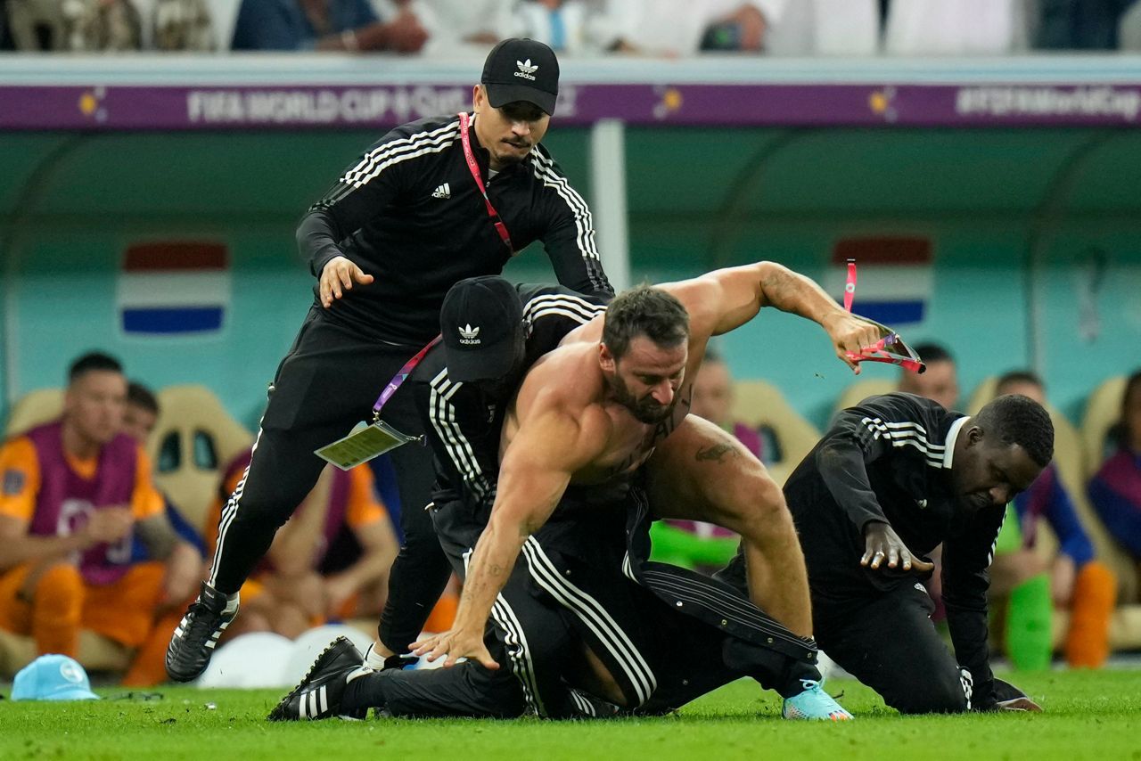 Fan runs on field during at World Cup