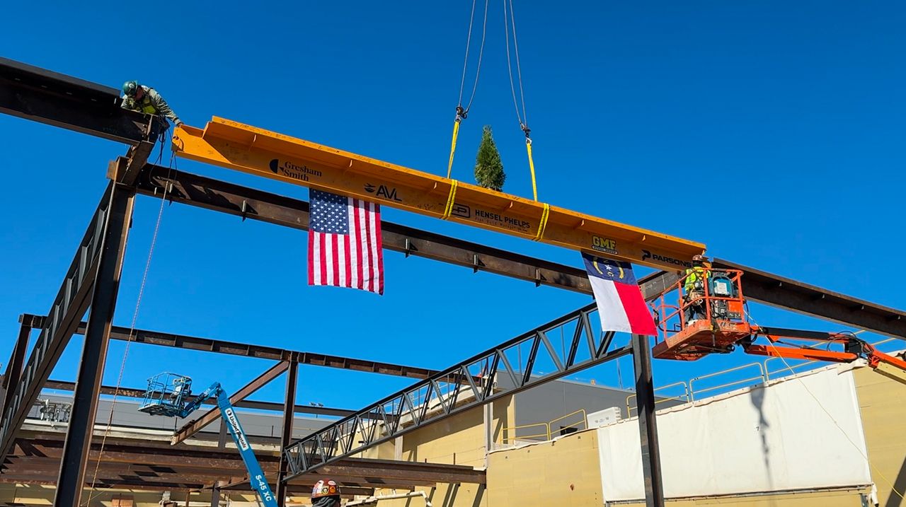 Asheville airport celebrates new terminal by placing last structural beam