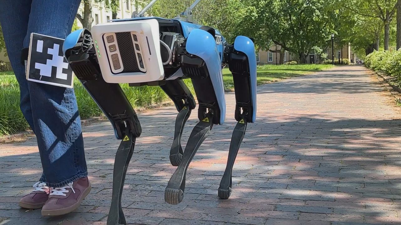 Spot, a Boston Dynamics robot dog, is being retrofitted by a UNC student to act as a guide companion.