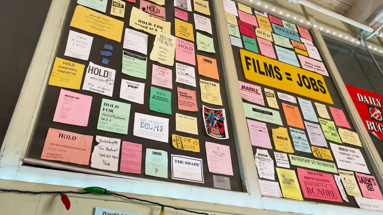 A display showcases the various films and TV shows that have used pieces from Westerman Prop Store. (Spectrum News 1/Devin Bates)