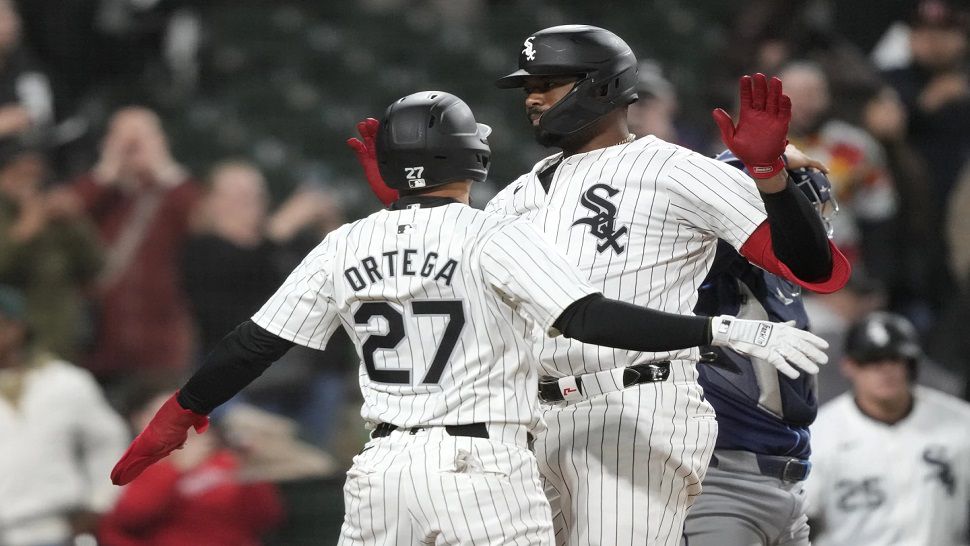 Chicago White Sox's Eloy Jiménez, right, celebrates after his two-run home run with Rafael Ortega during the seventh inning of a baseball game against the Tampa Bay Rays, Friday, April 26, 2024, in Chicago. (AP Photo/Charles Rex Arbogast)