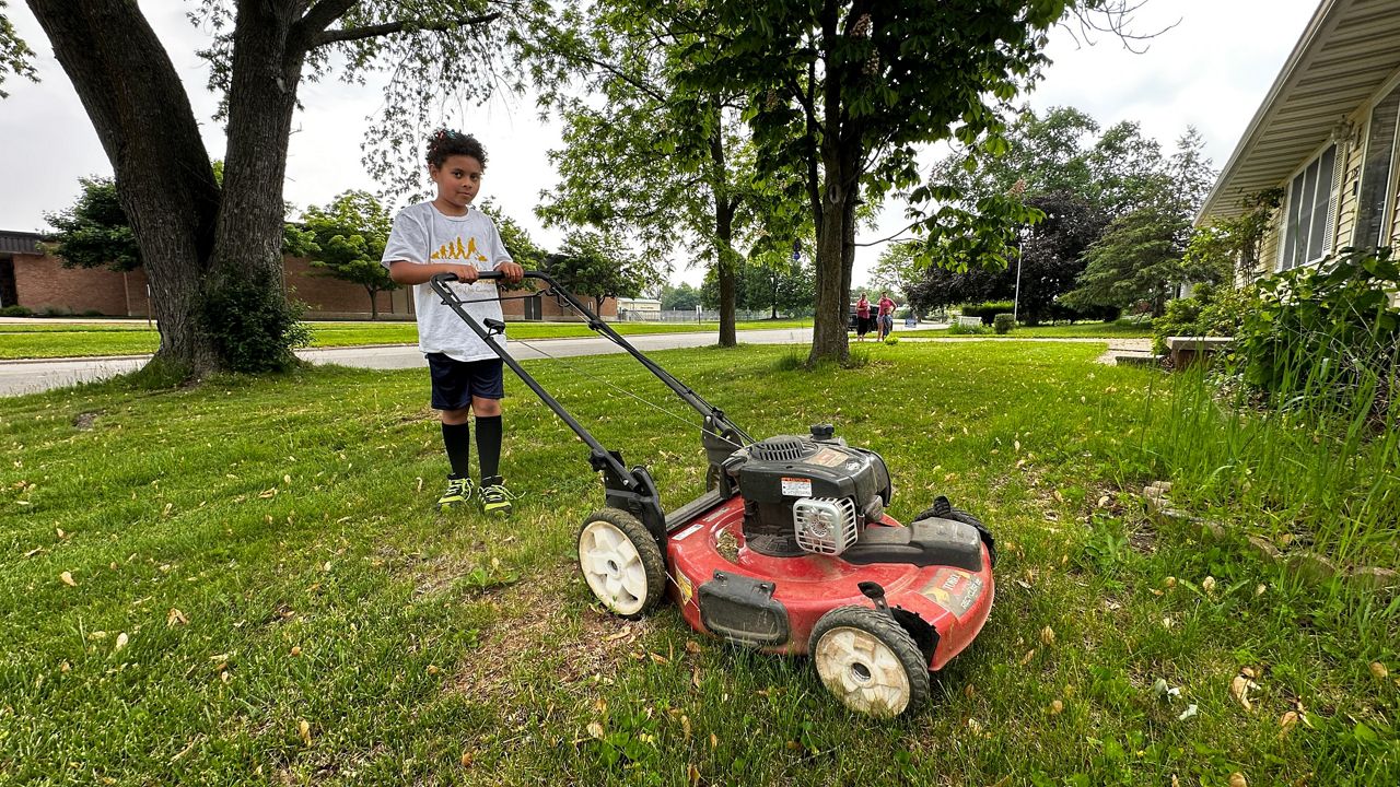 After completing the 50-yard challenge, kids are given a lawnmower to possibly start their own business