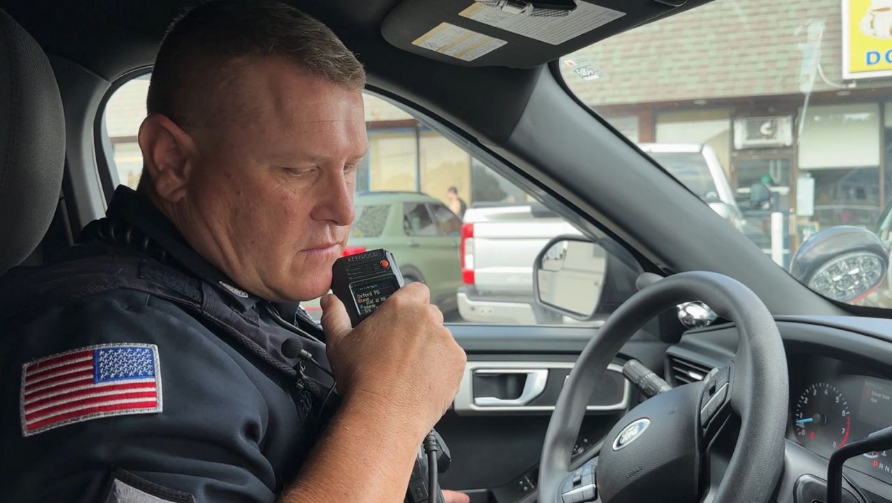 Officer Kevin Mercier in his vehicle. (Spectrum News 1/Cam Jandrow)