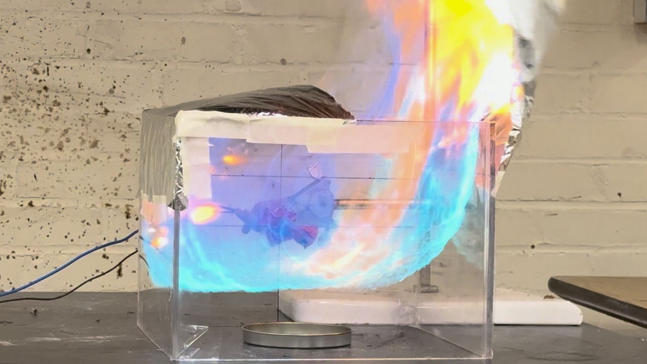 Flames erupt as part of an experiment at Worcester Polytechnic Institute on Wednesday. (Spectrum News 1/Devin Bates)