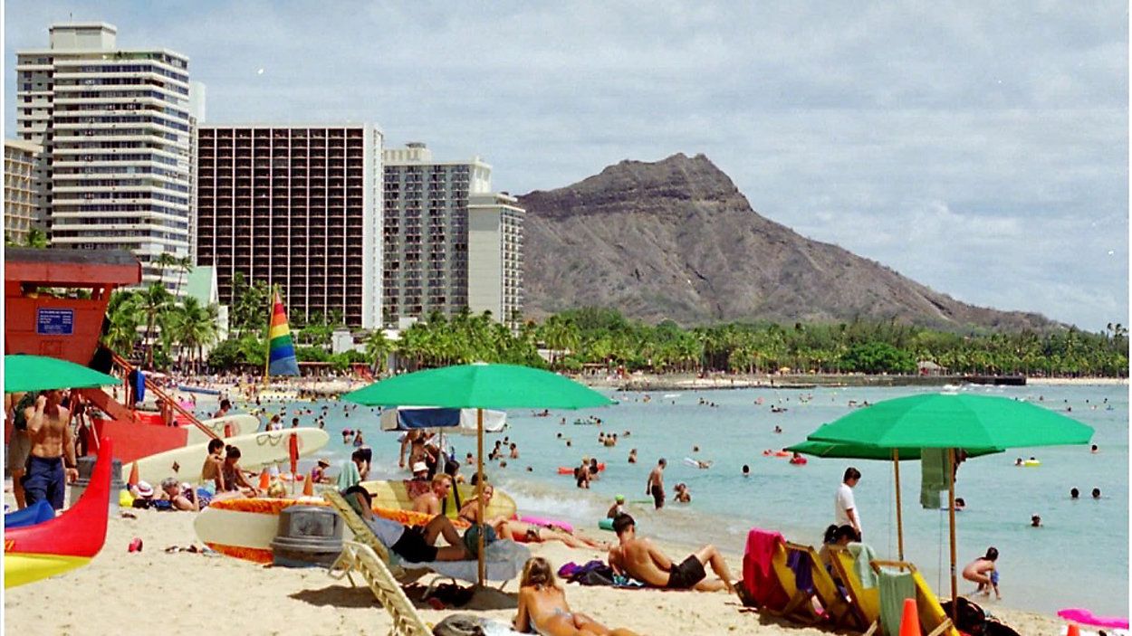 According to the latest UHERO economic forecast, despite lower tourism figures overall this year, Oahu experienced a boost in tourism over the summer. (Associated Press, file)