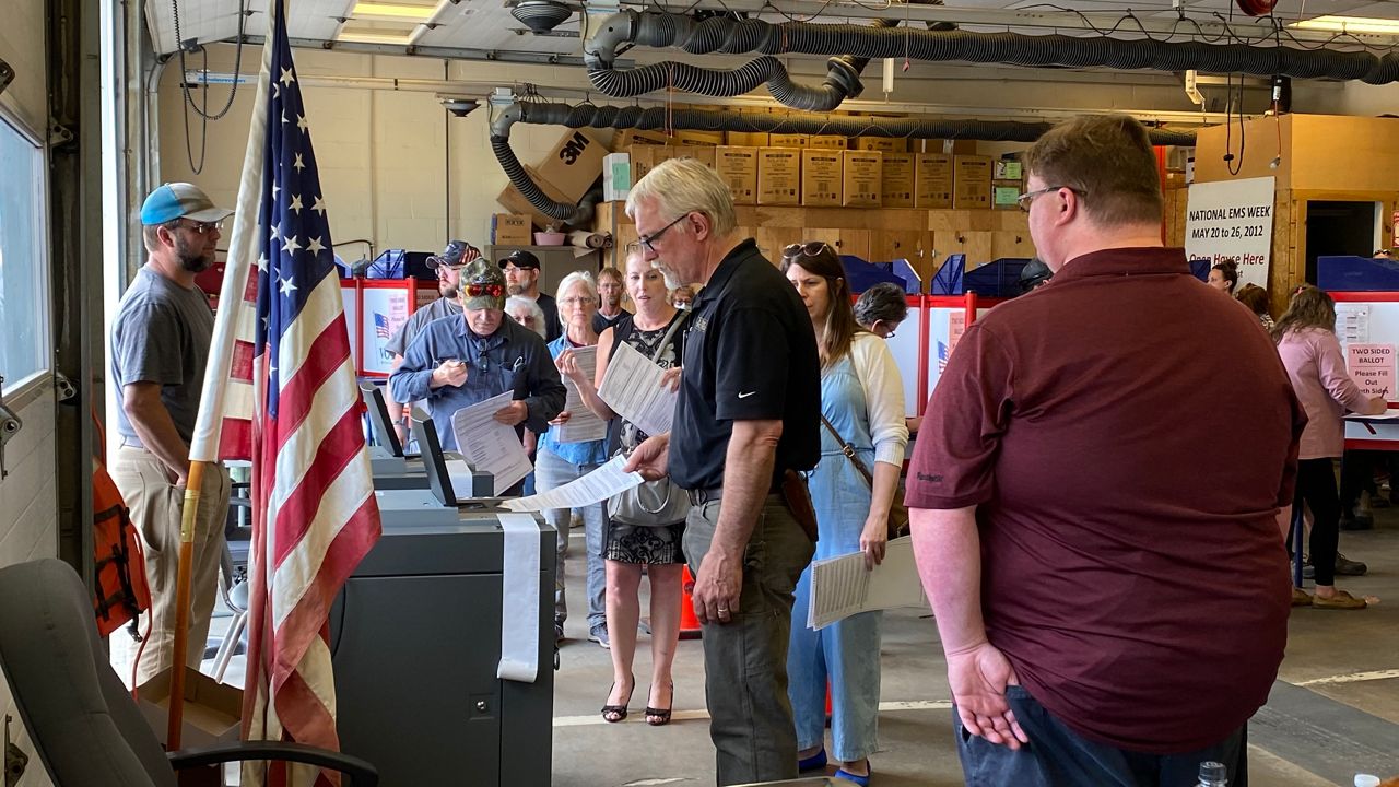 Waldoboro voters line up Tuesday to cast their ballots at town hall. (Spectrum News/Susan Cover)