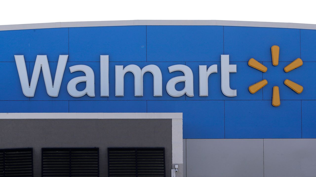 A Walmart logo is displayed outside of a Walmart store, in Walpole, Mass., Sept. 3, 2019. (AP Photo/Steven Senne, File)