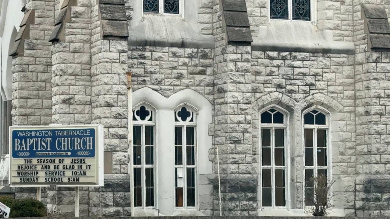 A sign in front of the Washington Tabernacle Baptist church reads "The season of Jesus rejoice and be glad in it" (Spectrum News/Lauren Brennecke)