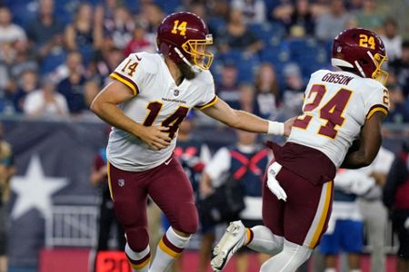 Washington Football Team quarterback Ryan Fitzpatrick (14) throws