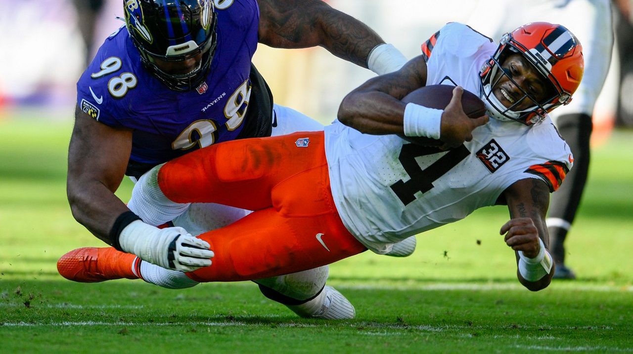 Cleveland Browns quarterback Deshaun Watson is tackled by Baltimore Ravens defensive tackle Travis Jones during the first half on an NFL football game Sunday, Nov. 12, 2023, in Baltimore. 