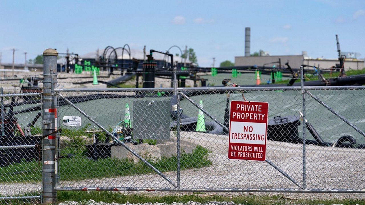 A no trespassing sign hangs on a fence around the West Lake Landfill Superfund site on Friday, April 21, 2023, in Bridgeton, Mo. (AP Photo/Jeff Roberson)