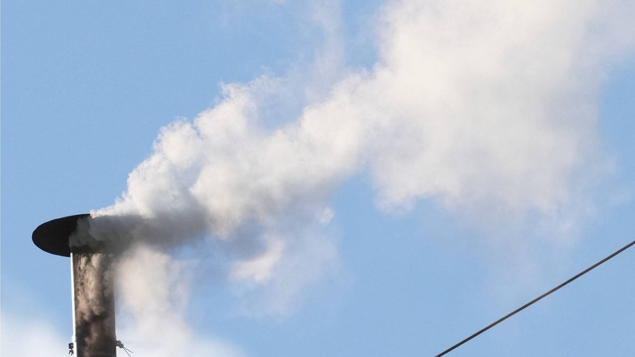 White smoke billows from the chimney of the Sistine Chapel during the conclave to elect a new pope, at the Vatican, Thursday, May 8, 2025. (AP Photo/Andrew Medichini)