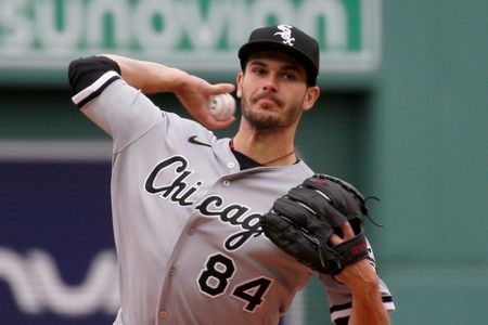 Chicago White Sox starting pitcher Dylan Cease (84) stands on the