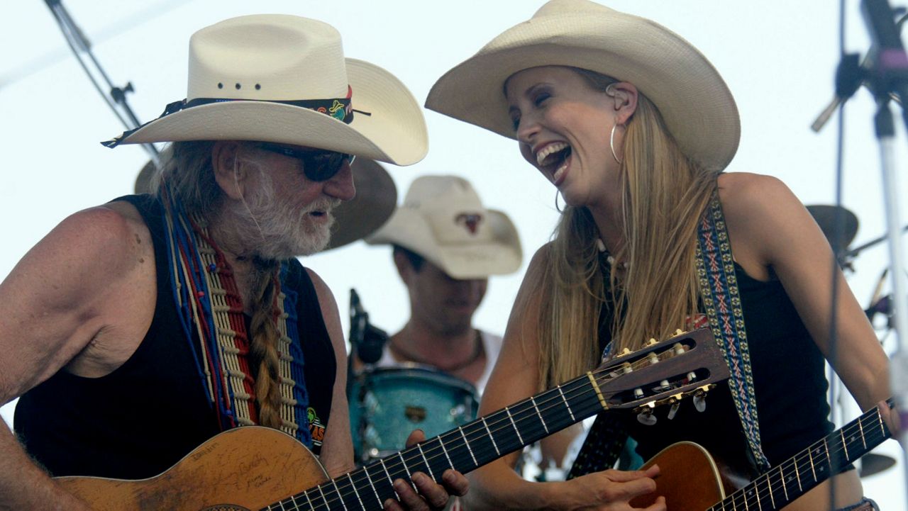 Willie Nelson performs with Pauline Reese at Willie Nelson's annual 4th of July Picnic, Monday, July 4, 2005, in Fort Worth, Texas. (AP Photo/Matt Slocum)