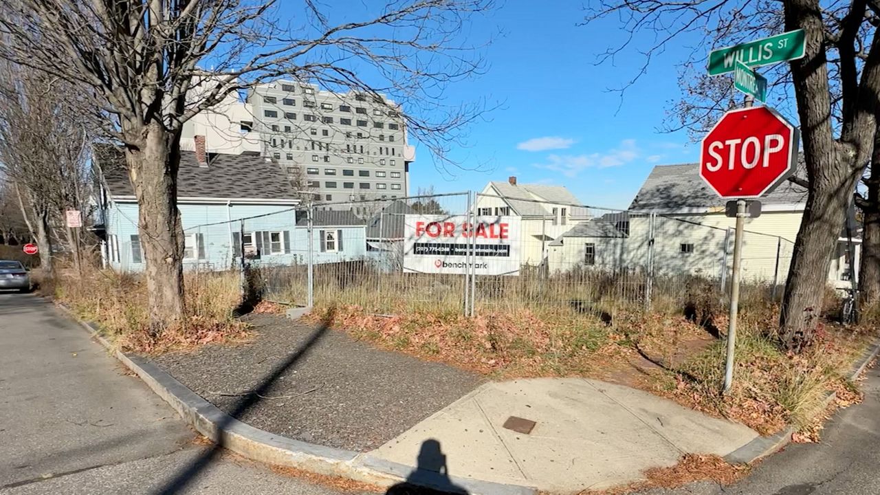 The Portland Planning Board is holding a public hearing tonight on a proposal to build a condominium complex in this empty lot on Willis Street in the city's Munjoy Hill neighborhood. Critics charge the building violates regulations and wouldn't match the character of the area. (Spectrum News file photo)