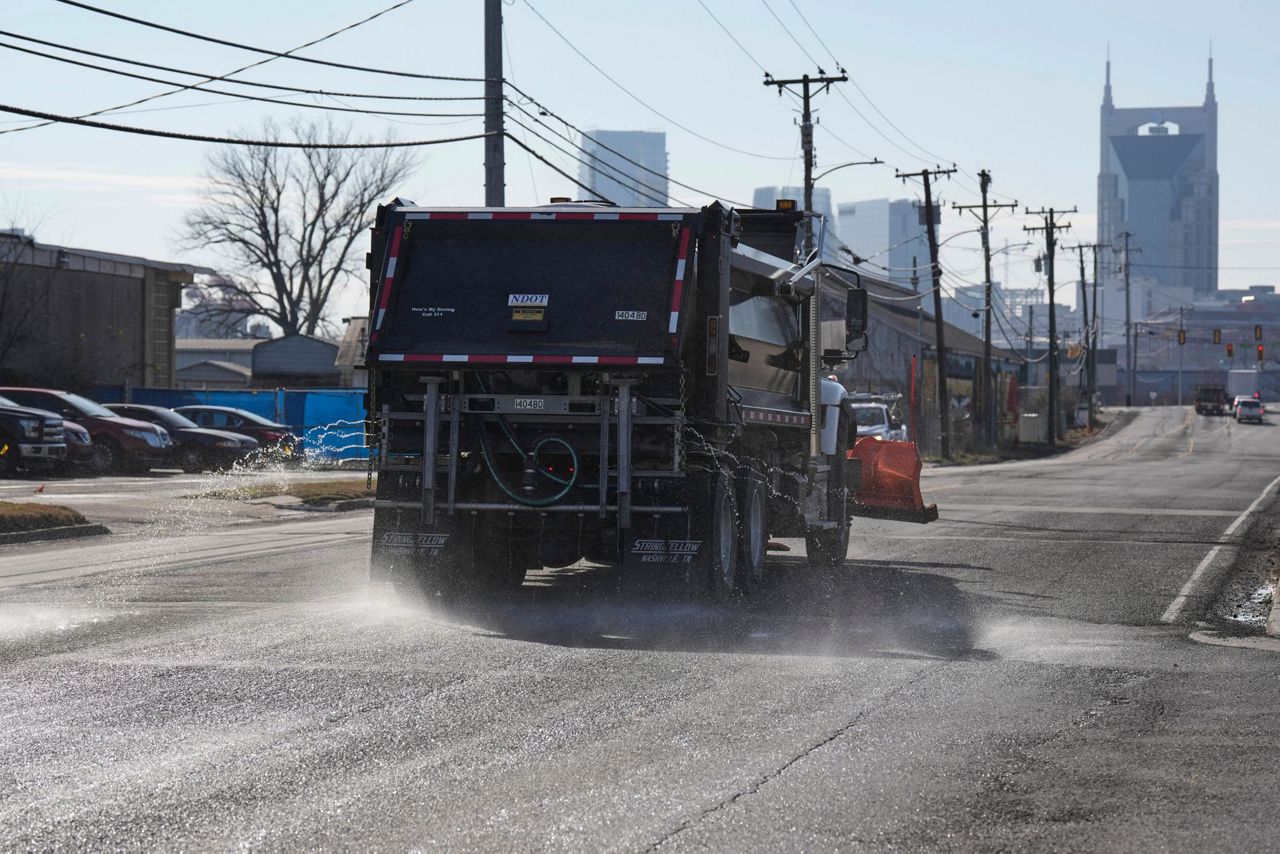 Crews spread salt on roads and people stock up on batteries as a winter ...